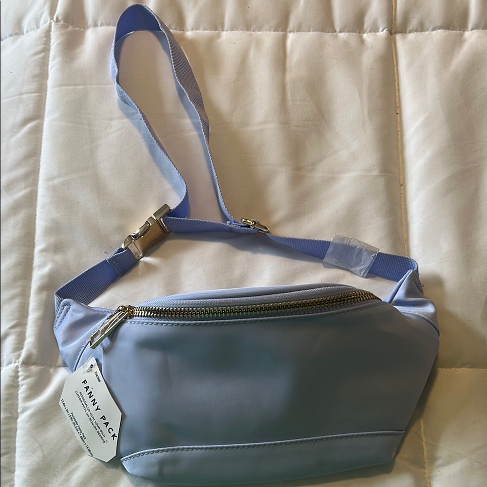 Blue Crossbody Bag with Adjustable Strap and Gold Hardware